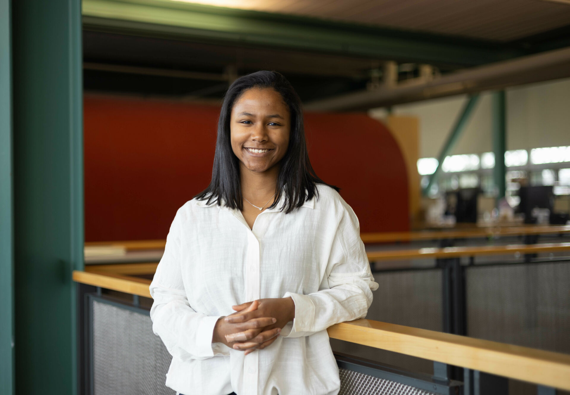 Student, Kimberly Cunningham, poses against a railing at the Stuckeman Family Building