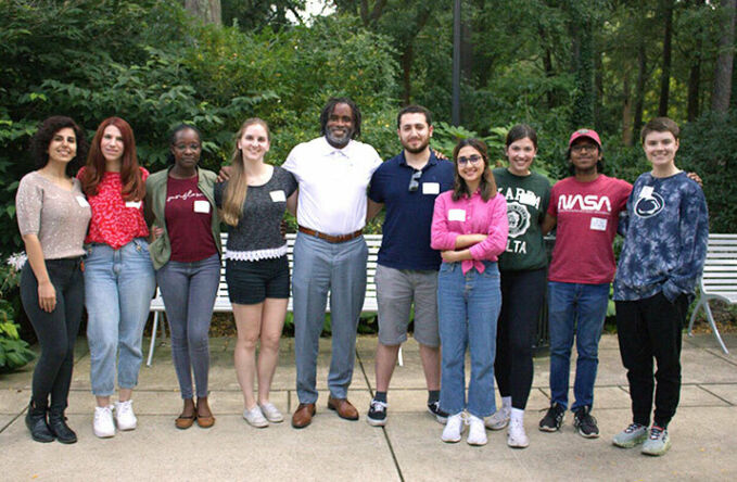 Dean Esters in a group photo with students.