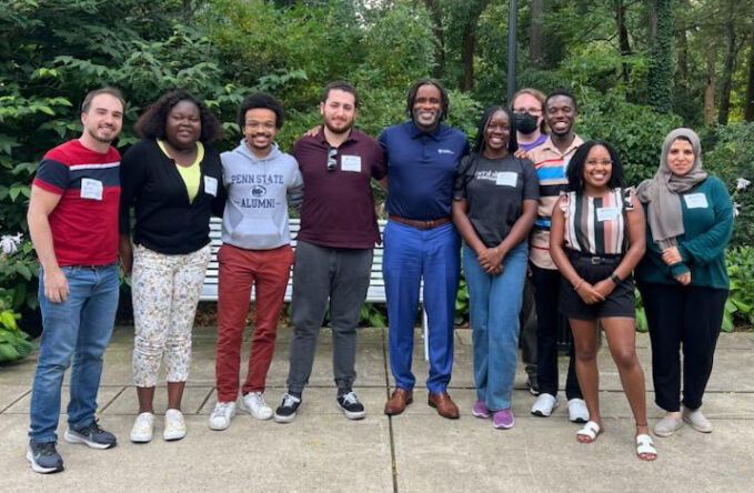 Dean Esters in a group photo with students.