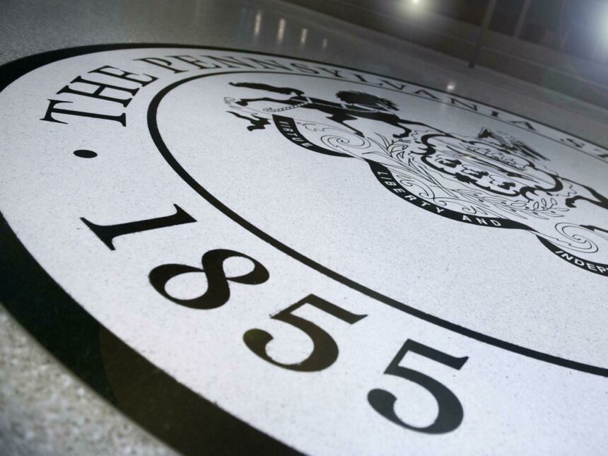 Penn State Seal on HUB floor, 1855 visible.